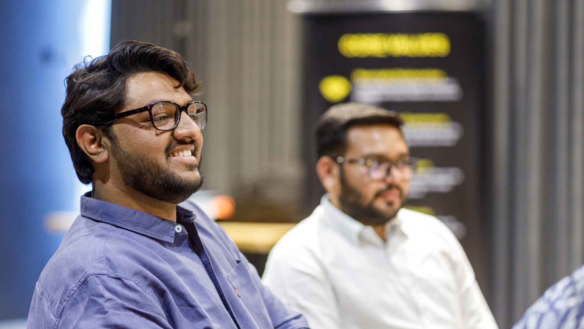 Women walking between trees